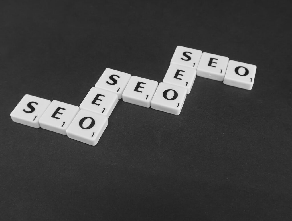 SEO spelled out multiple times using scrabble tiles